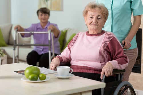 Older disabled woman on wheelchair in nursing home.